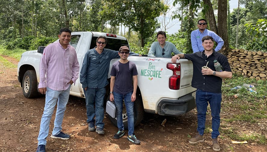 Nescafé coffee supply chain traceability map showing farm locations in Mexico, collection centers, processing facilities, and digital records flowing from origin to factory with blockchain verification